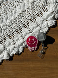 Pink Droopy Smiley Badge Reel