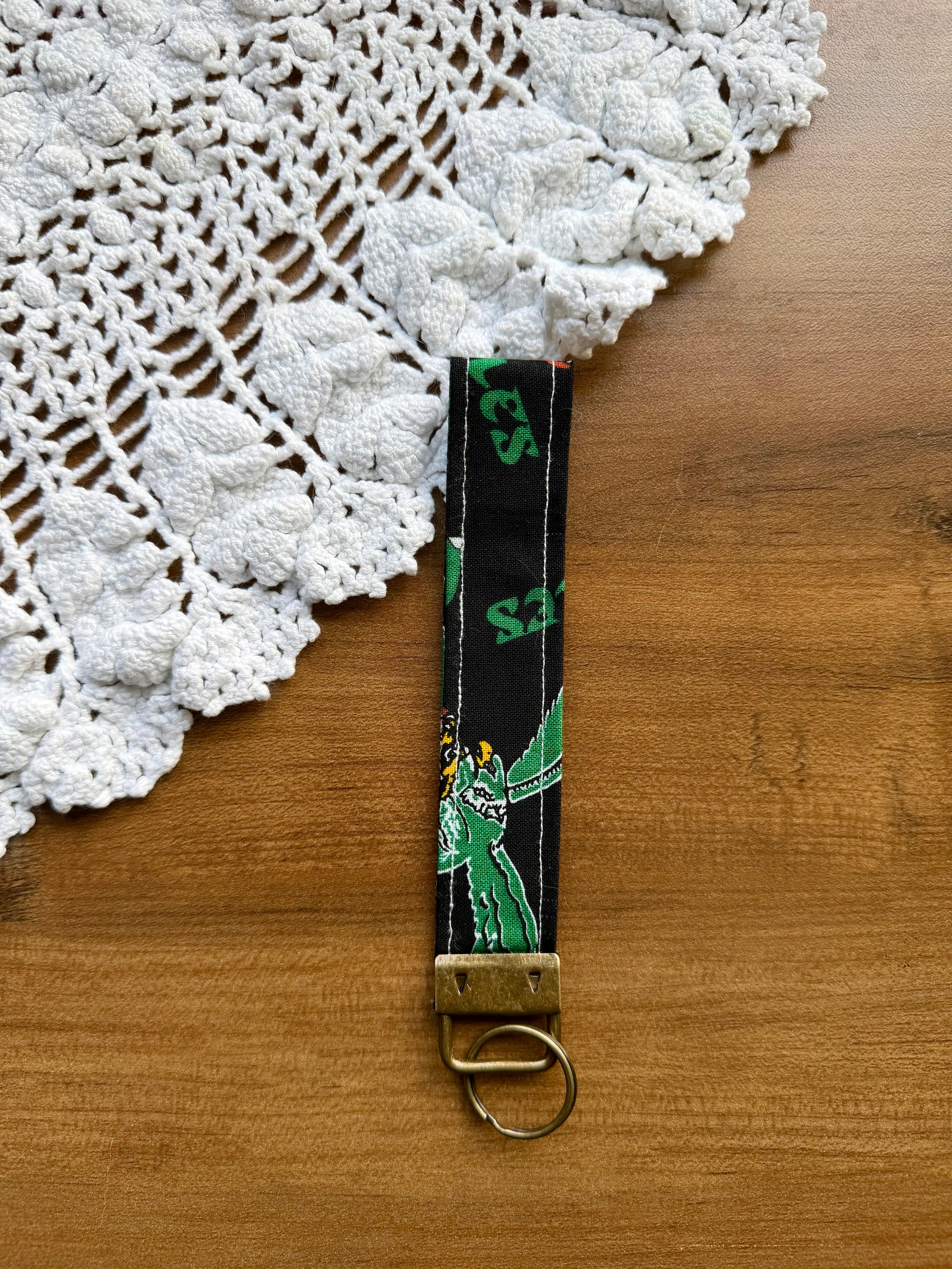 The Green Team Wristlet w/ Bronze Keychain