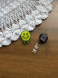 Yellow Droopy Smiley Badge Reel